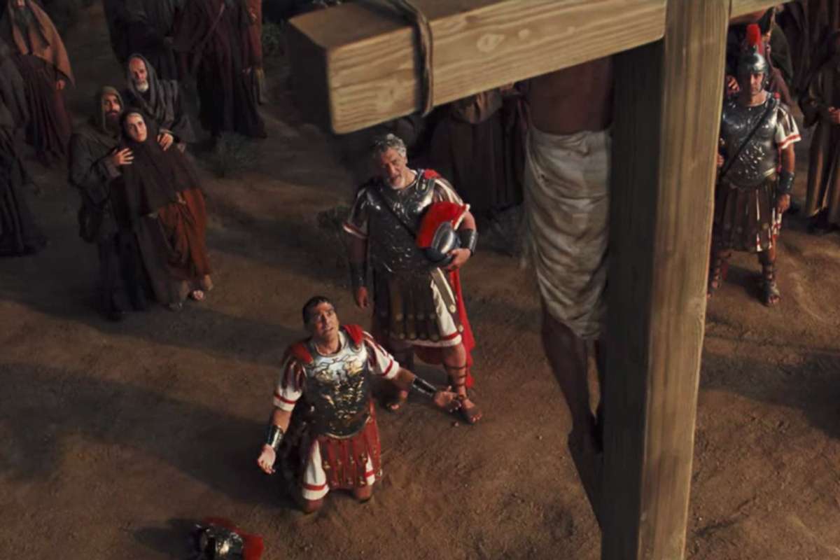 Caesar kneels before Jesus on the cross