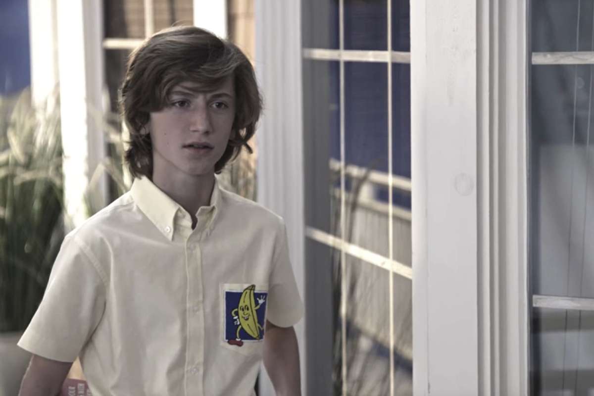 young Michael Bluth in his banana stand uniform